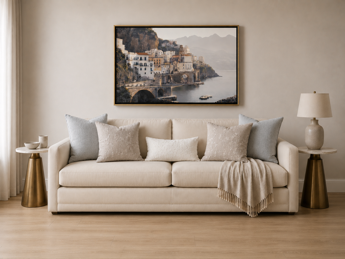 Layered neutral sofa styling with brass side tables
